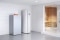 The picture shows a DHW heat pump in combination with a condensing boiler next to the sauna